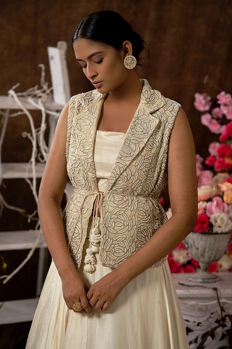 A model showcasing Ivory Skirt And Jacket Set by Farha Syed from Farha Syed's collection