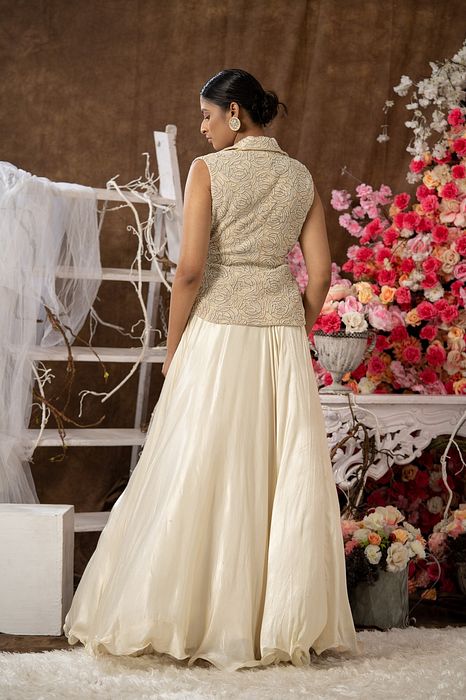 A model showcasing Ivory Skirt And Jacket Set by Farha Syed from Farha Syed's collection