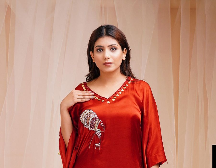 A model showcasing Rust Red Kaftan by Farha Syed from Farha Syed's collection A model showcasing Rust Red Kaftan by Farha Syed from Farha Syed's collection