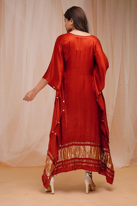 A model showcasing Rust Red Kaftan by Farha Syed from Farha Syed's collection A model showcasing Rust Red Kaftan by Farha Syed from Farha Syed's collection