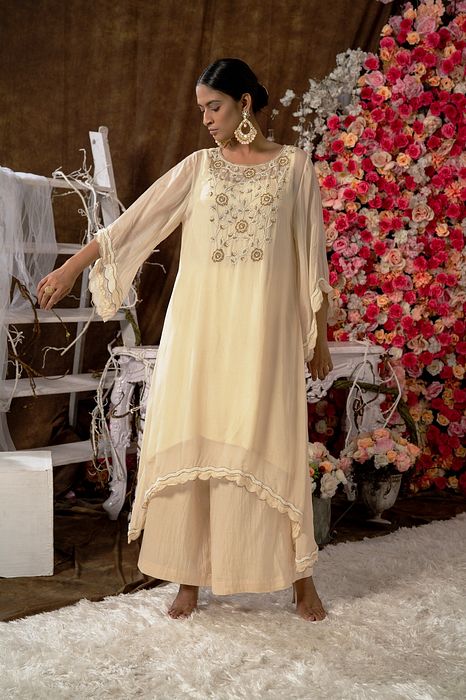 A model showcasing Ivory Kurta Set by Farha Syed from Farha Syed's collection