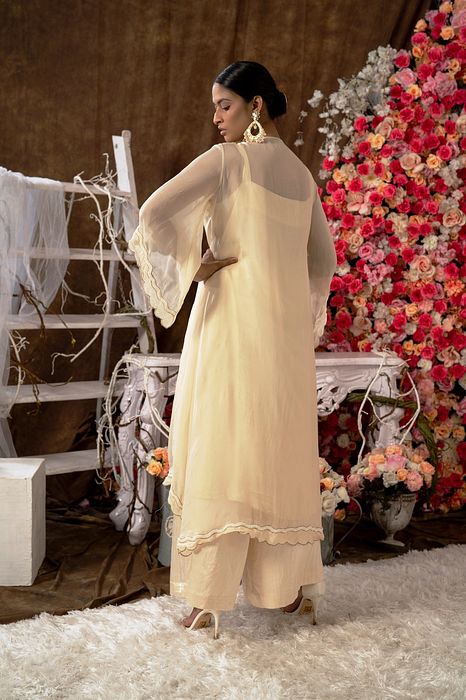 A model showcasing Ivory Kurta Set by Farha Syed from Farha Syed's collection