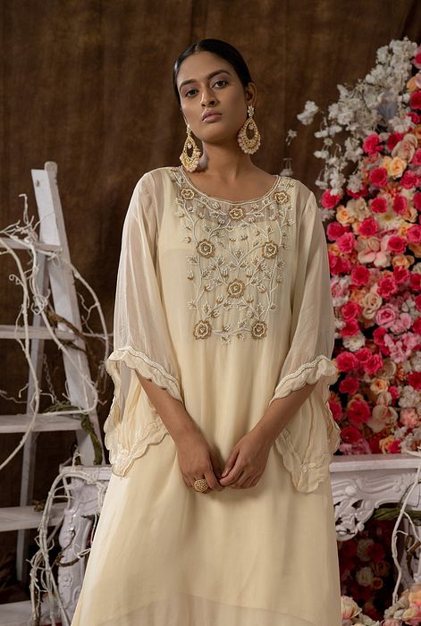 A model showcasing Ivory Kurta Set by Farha Syed from Farha Syed's collection