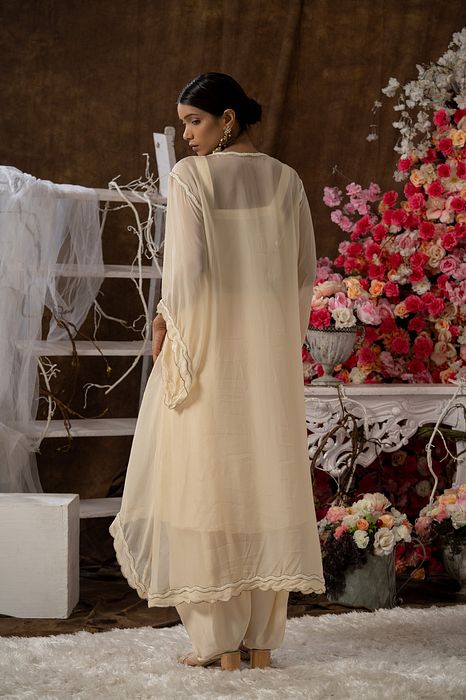 A model showcasing Ivory Kurta And Dhoti Set by Farha Syed from Farha Syed's collection