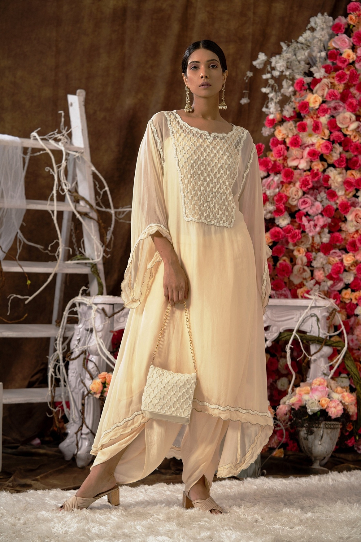 A model showcasing Ivory Kurta And Dhoti Set Feature image by Farha Syed from Farha Syed's collection