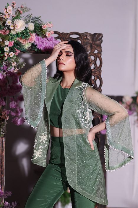 A model showcasing Green Jacket And Pant Set by Ayushi Agarwal from Ayushi Agarwal's collection