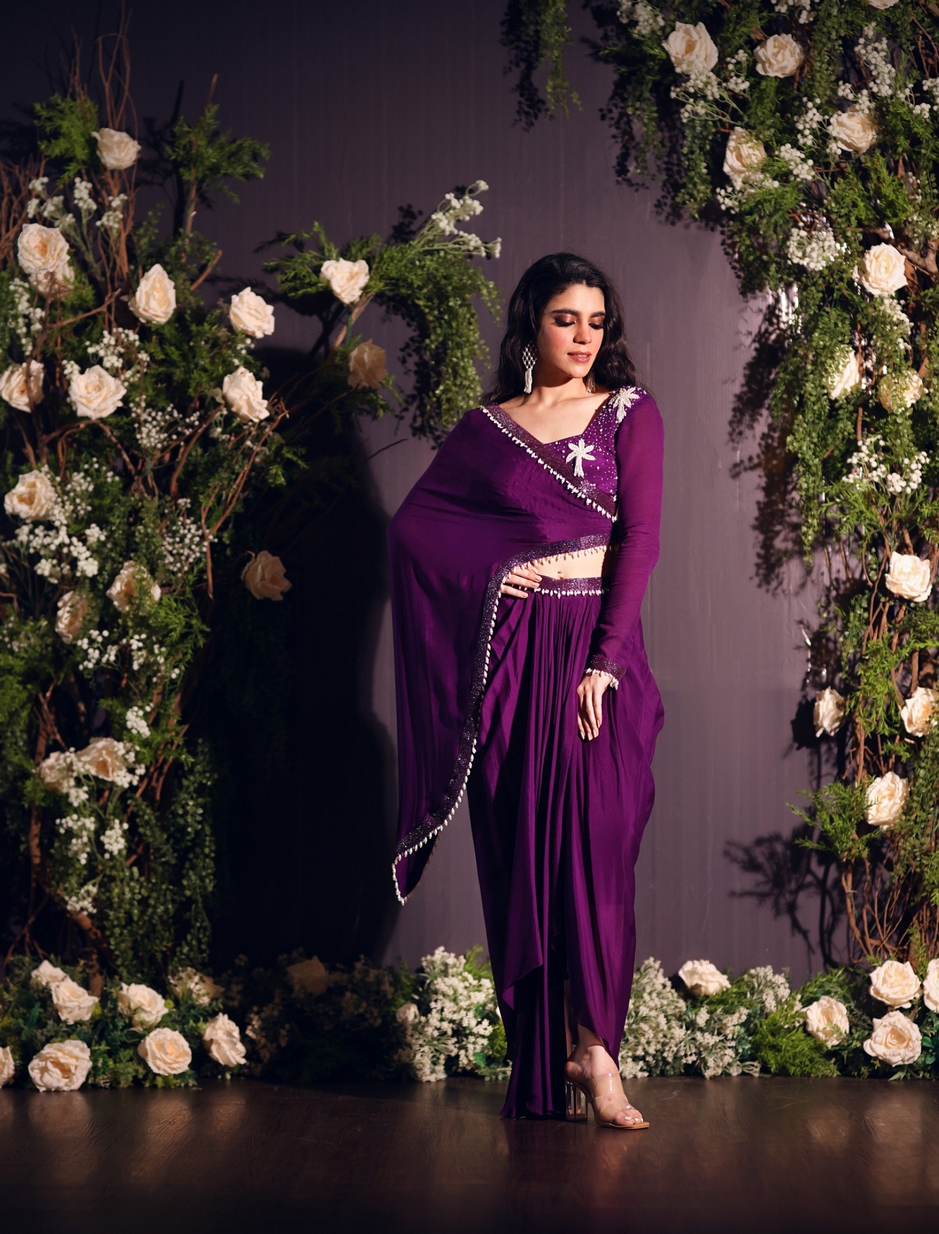 A model showcasing Purple Drape Skirt Set Feature image by Ayushi Agarwal from Ayushi Agarwal's collection