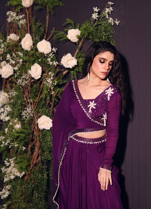 A model showcasing Purple Drape Skirt Set by Ayushi Agarwal from Ayushi Agarwal's collection