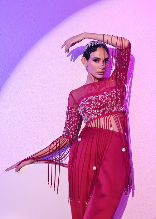 A model showcasing Fuschia Top And Skirt Set by Ayushi Agarwal from Ayushi Agarwal's collection