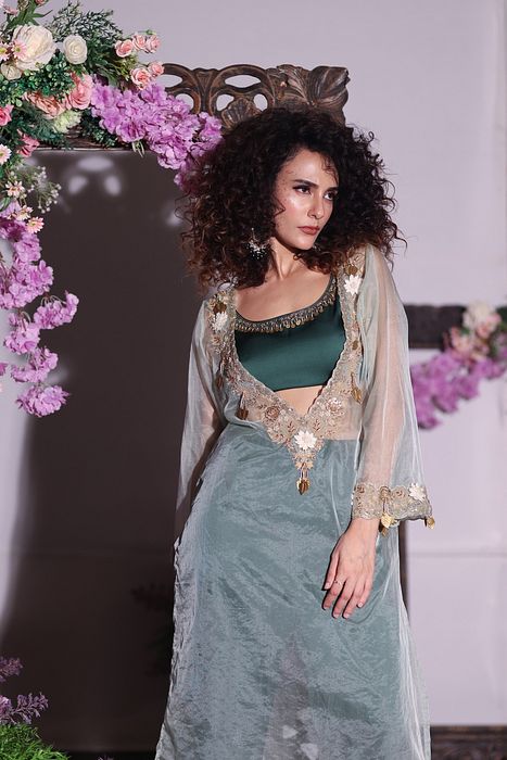 A model showcasing Bottle Green Pant Set With Kurta by Ayushi Agarwal from Ayushi Agarwal's collection