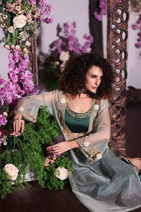 A model showcasing Bottle Green Pant Set With Kurta by Ayushi Agarwal from Ayushi Agarwal's collection