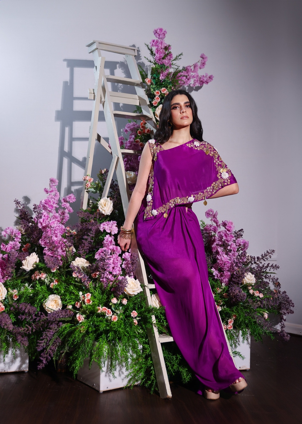 A model showcasing Purple Drape Skirt And Top Set Feature image by Ayushi Agarwal from Ayushi Agarwal's collection