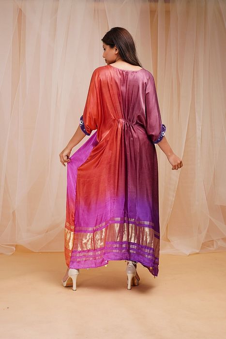 A model showcasing Violet Pink And Rust Red Shaded Kaftaan by Farha Syed from Farha Syed's collection A model showcasing Violet Pink And Rust Red Shaded Kaftaan by Farha Syed from Farha Syed's collection