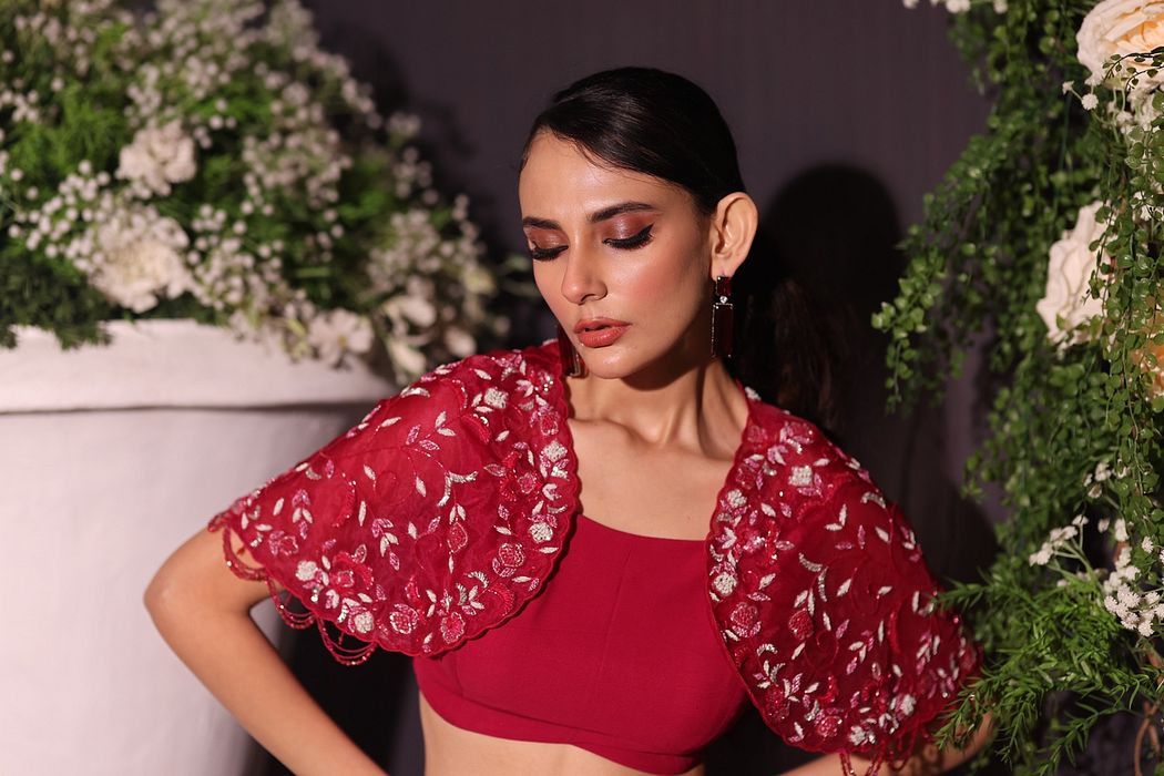 A model showcasing Fuschia Drape Skirt Set by Ayushi Agarwal from Ayushi Agarwal's collection