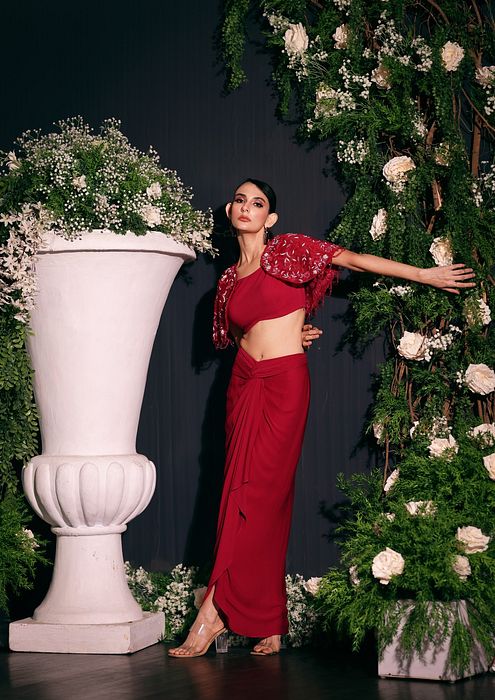 A model showcasing Fuschia Drape Skirt Set by Ayushi Agarwal from Ayushi Agarwal's collection