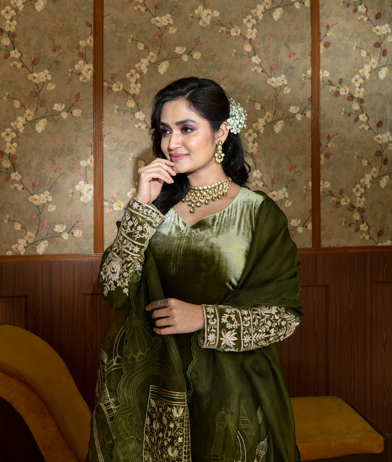 A model showcasing Green Inara Velvet Suit Set by Ayushi Agarwal from Ayushi Agarwal's collection A model showcasing Green Inara Velvet Suit Set by Ayushi Agarwal from Ayushi Agarwal's collection