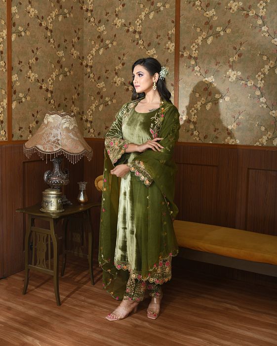 A model showcasing Green Gul Velvet Suit Set by Ayushi Agarwal from Ayushi Agarwal's collection