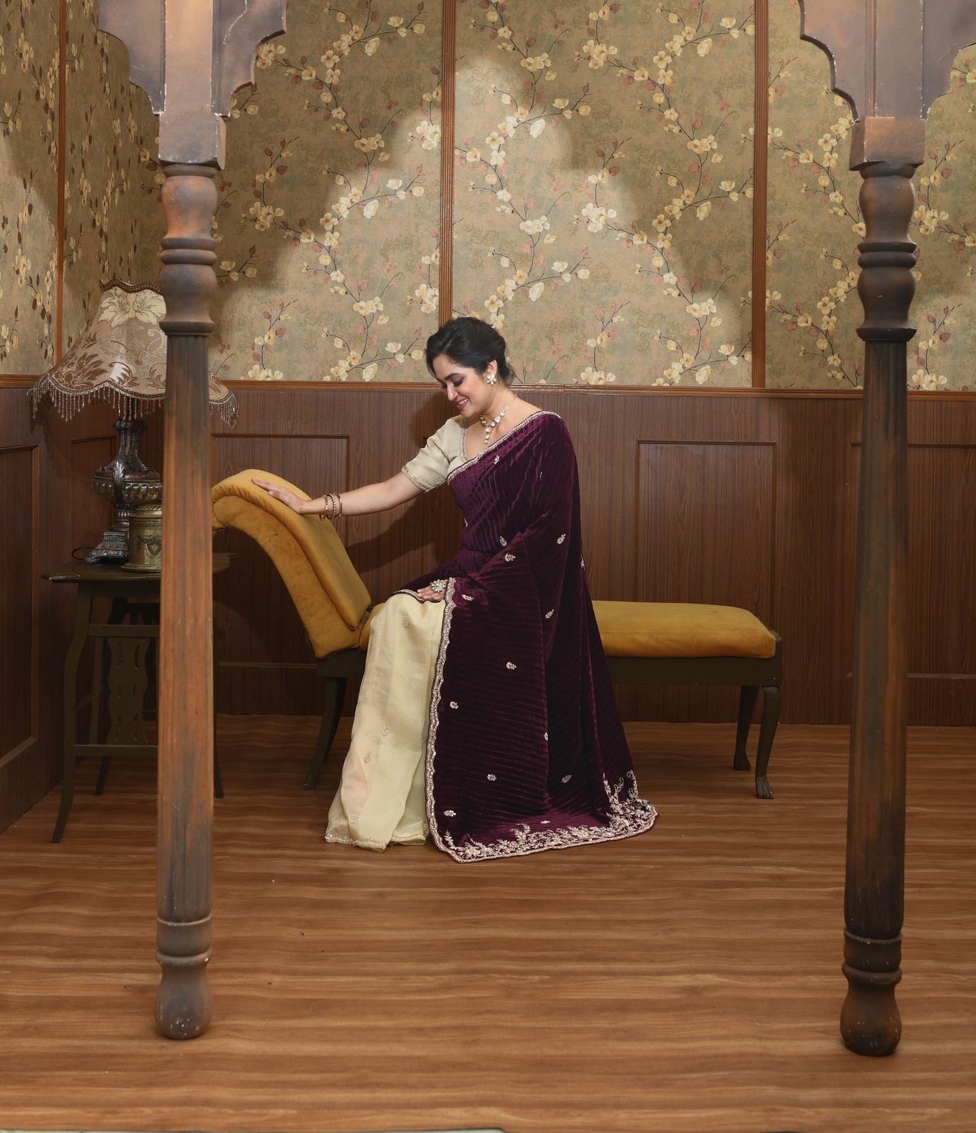 A model showcasing Kira Gold And Magenta Velvet Saree by Ayushi Agarwal from Ayushi Agarwal's collection A model showcasing Kira Gold And Magenta Velvet Saree by Ayushi Agarwal from Ayushi Agarwal's collection