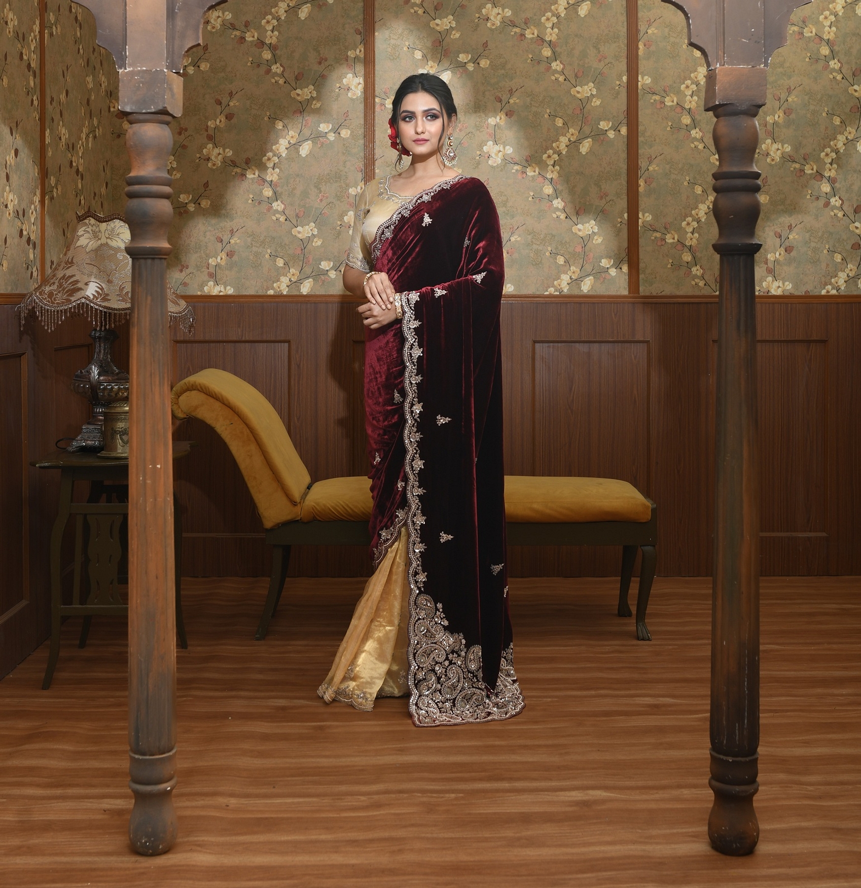 A model showcasing Ahana Gold And Maroon Velvet Saree Feature image by Ayushi Agarwal from Ayushi Agarwal's collection