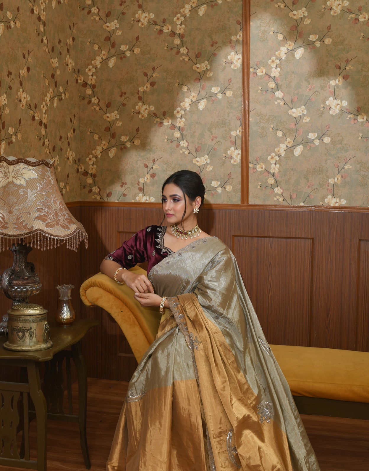A model showcasing Inara Gold And Silver Metallic Saree by Ayushi Agarwal from Ayushi Agarwal's collection
