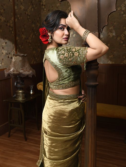 A model showcasing Aisha Green Saree by Ayushi Agarwal from Ayushi Agarwal's collection A model showcasing Aisha Green Saree by Ayushi Agarwal from Ayushi Agarwal's collection