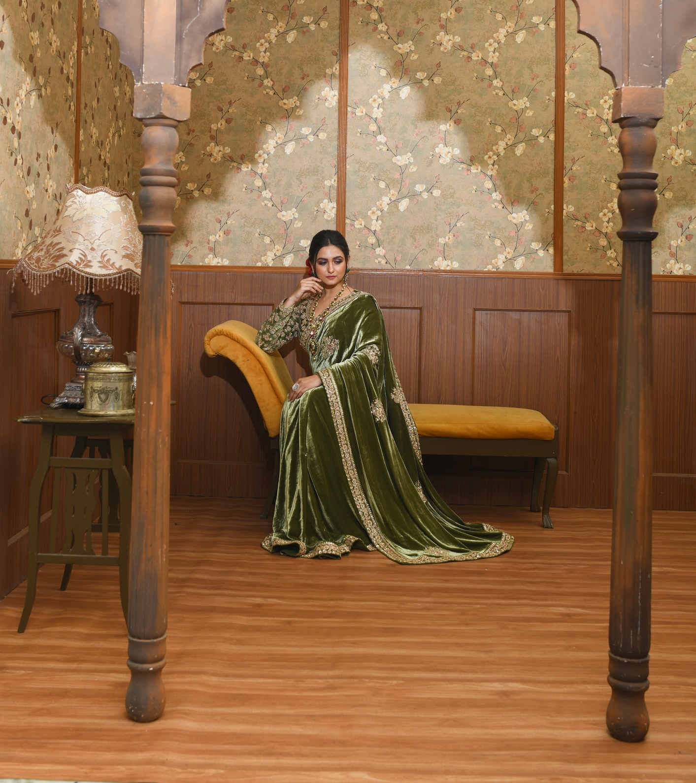 A model showcasing Adya Green Velvet Saree by Ayushi Agarwal from Ayushi Agarwal's collection