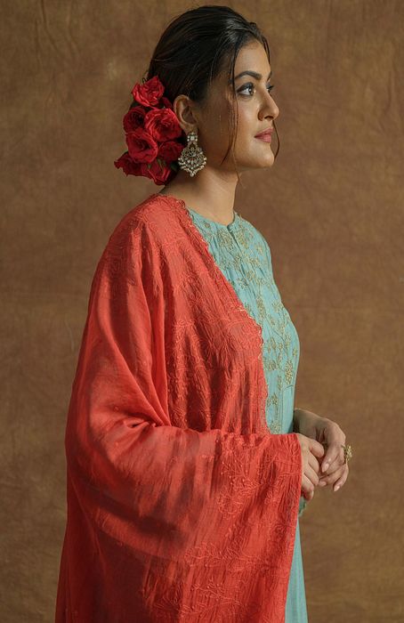 A model showcasing Mint Green Anarkali Set With Chudidaar And Dupatta by Farha Syed from Farha Syed's collection A model showcasing Mint Green Anarkali Set With Chudidaar And Dupatta by Farha Syed from Farha Syed's collection