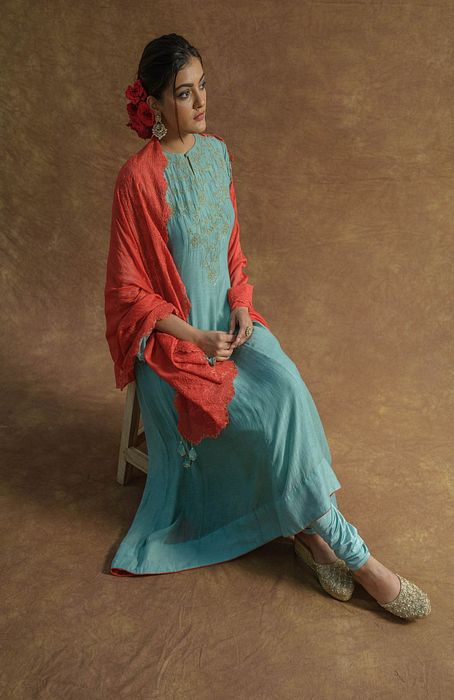 A model showcasing Mint Green Anarkali Set With Chudidaar And Dupatta by Farha Syed from Farha Syed's collection A model showcasing Mint Green Anarkali Set With Chudidaar And Dupatta by Farha Syed from Farha Syed's collection