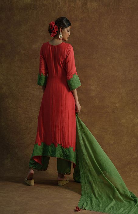 A model showcasing Red Kurta Set With Palazzo Pants And Dupatta by Farha Syed from Farha Syed's collection