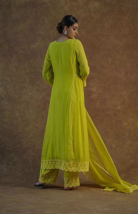 A model showcasing Lemon Yellow Kurta With Palazzo And Dupatta by Farha Syed from Farha Syed's collection