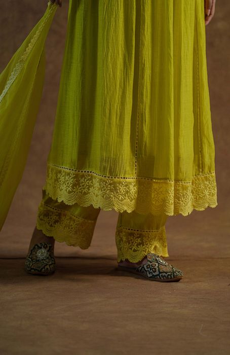 A model showcasing Lemon Yellow Kurta With Palazzo And Dupatta by Farha Syed from Farha Syed's collection