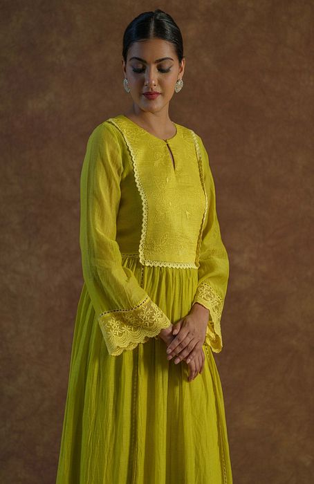 A model showcasing Lemon Yellow Kurta With Palazzo And Dupatta by Farha Syed from Farha Syed's collection