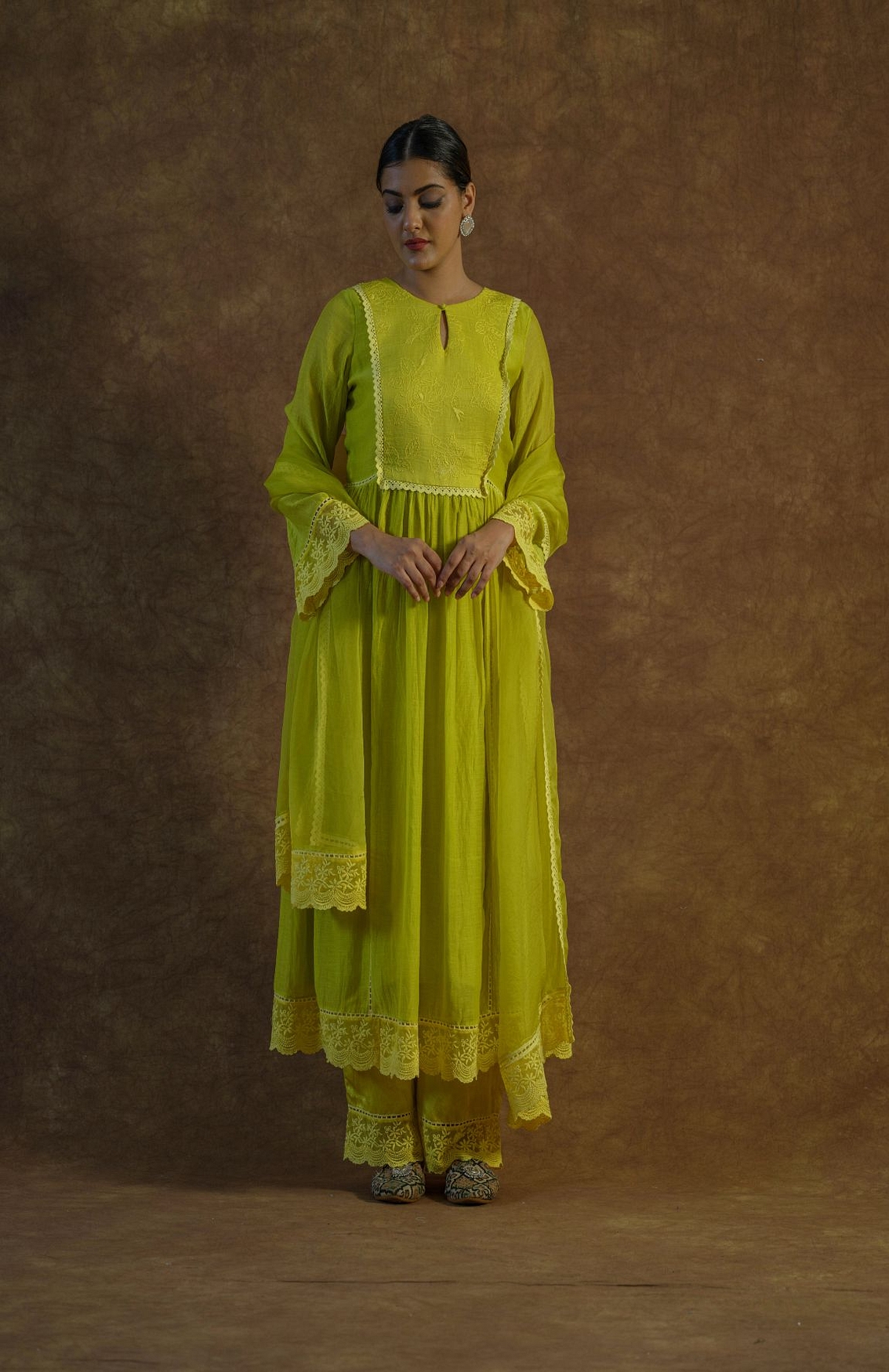 A model showcasing Lemon Yellow Kurta With Palazzo And Dupatta Feature image by Farha Syed from Farha Syed's collection