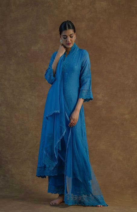 A model showcasing Teal Blue Kurta Set With Palazzo And Dupatta by Farha Syed from Farha Syed's collection