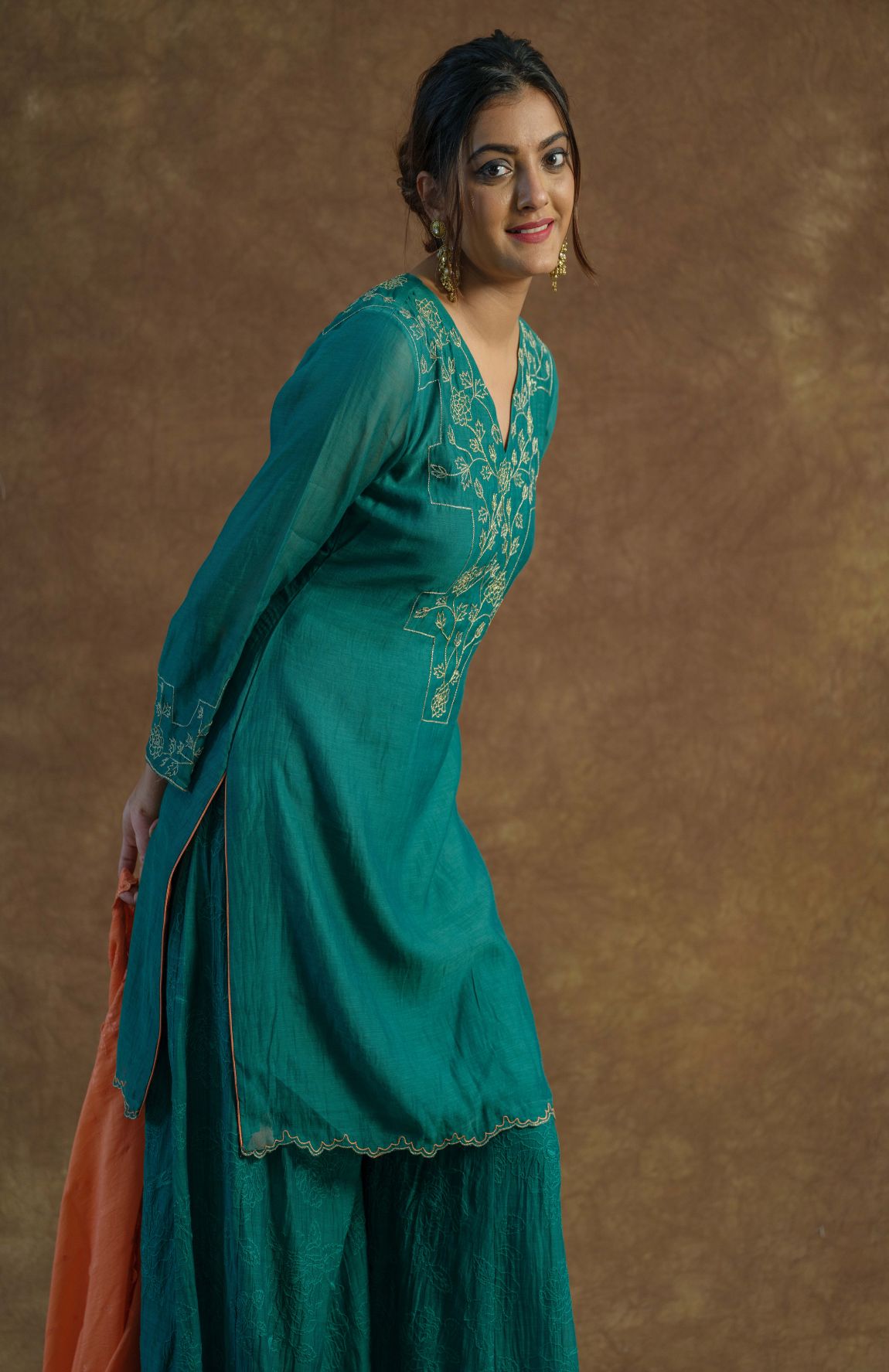 A model showcasing Emerald Green Sharara And Kurta Set by Farha Syed from Farha Syed's collection