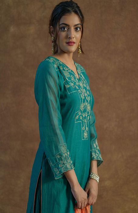 A model showcasing Emerald Green Sharara And Kurta Set by Farha Syed from Farha Syed's collection