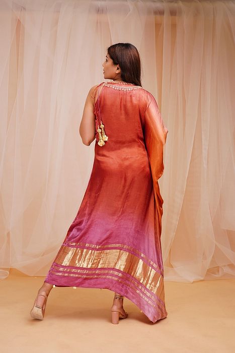 A model showcasing Mulberry Violet Orangutan Orange Shaded Kaftaan by Farha Syed from Farha Syed's collection A model showcasing Mulberry Violet Orangutan Orange Shaded Kaftaan by Farha Syed from Farha Syed's collection
