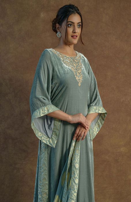 A model showcasing Greyish Green Kurta And Sharara Set by Farha Syed from Farha Syed's collection