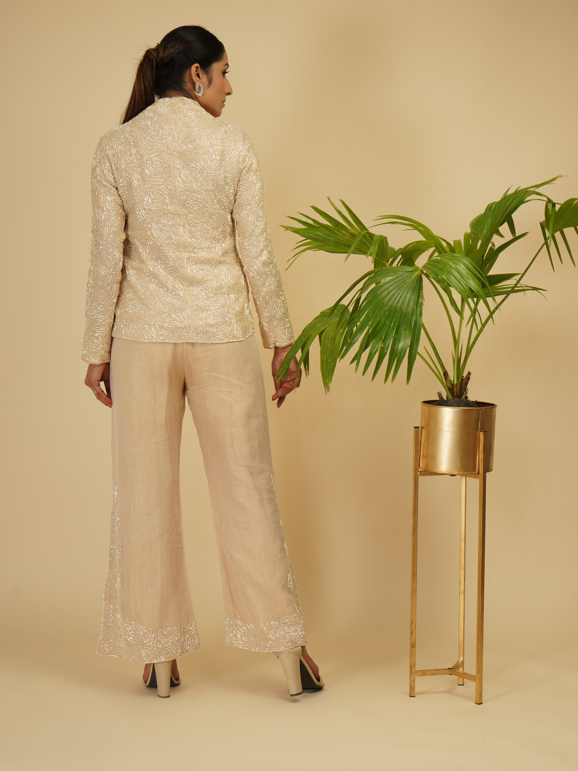 A model showcasing Ivory Gold 2 Piece Embroidered Coord Set by Farha Syed from Farha Syed's collection
