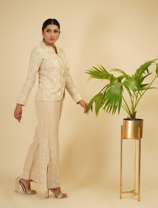 A model showcasing Ivory Gold 2 Piece Embroidered Coord Set by Farha Syed from Farha Syed's collection
