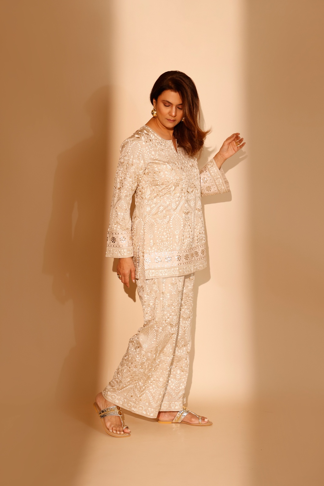A model showcasing Beige Eshayaa Twin Set by Ashtar from Ashtar's collection