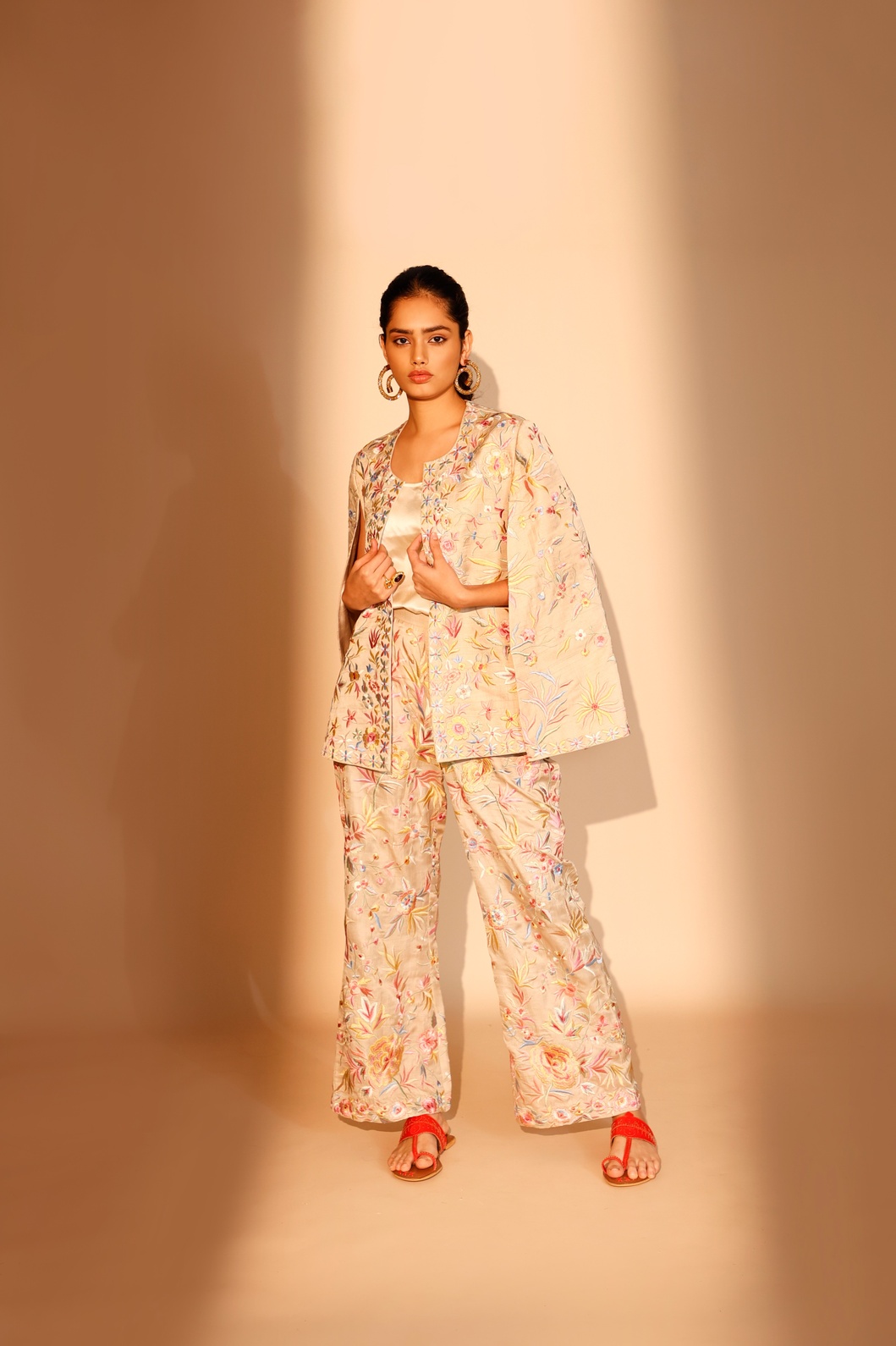 A model showcasing Beige Blossom Pants by Ashtar from Ashtar's collection