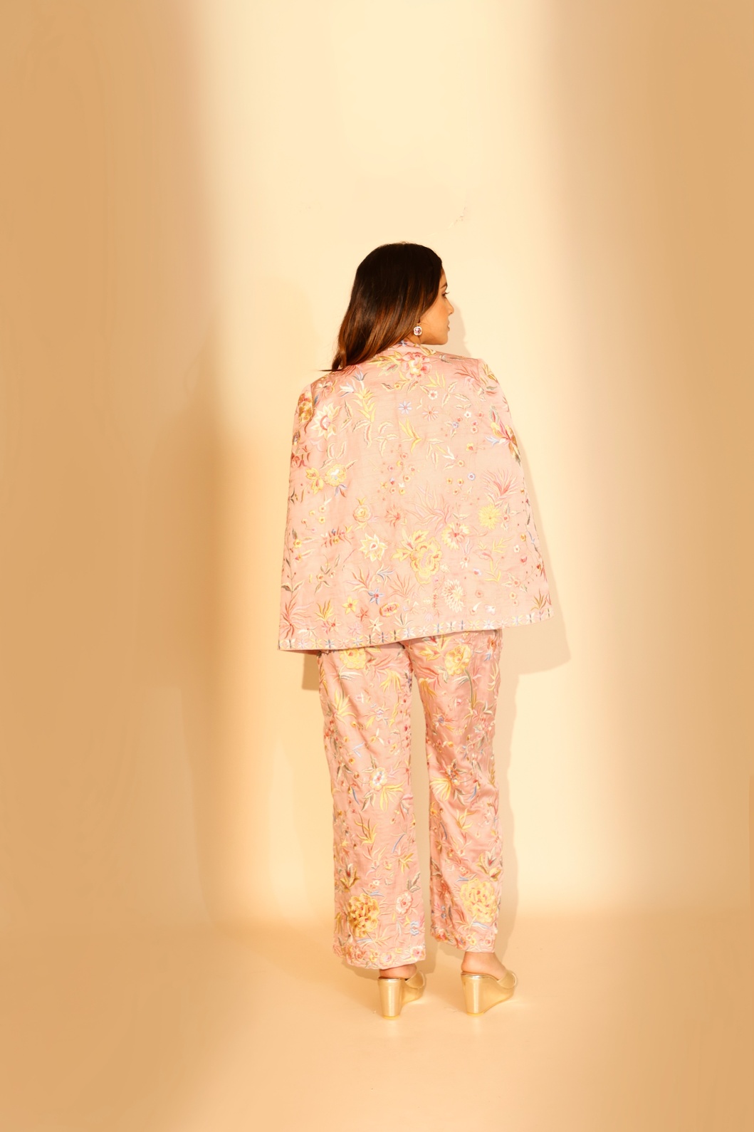 A model showcasing Baby Pink Blossom Pants by Ashtar from Ashtar's collection