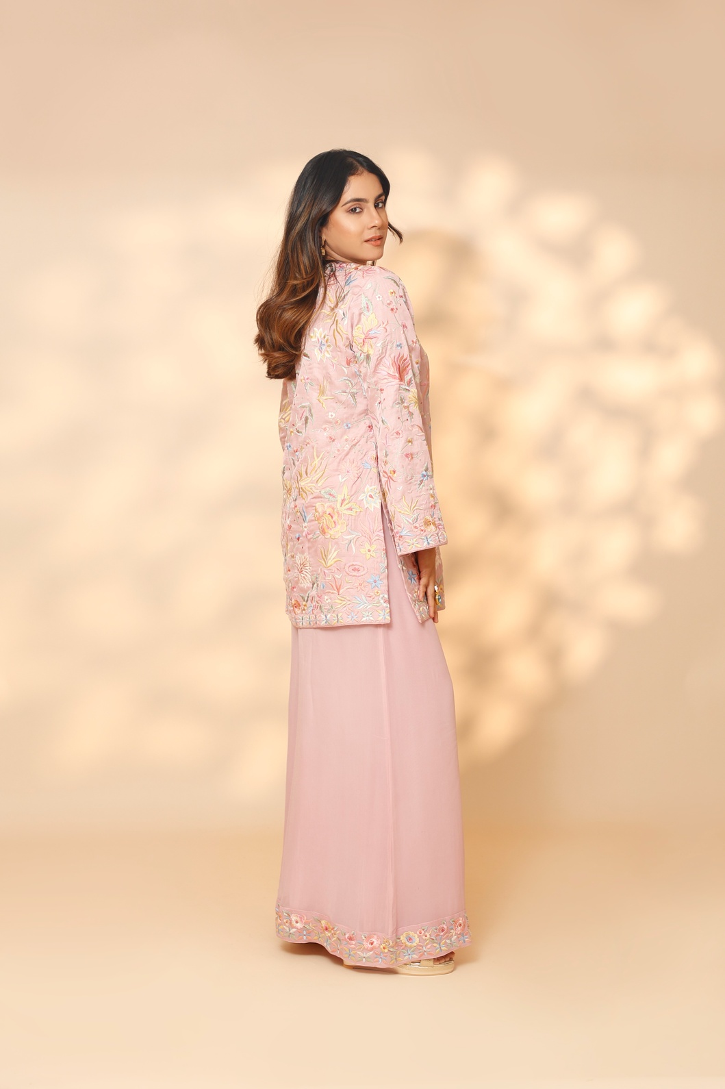 A model showcasing Baby Pink Blossom Sharara Set by Ashtar from Ashtar's collection