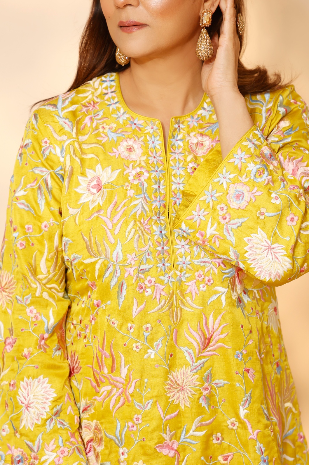 A model showcasing Yellow Blossom Sharara Set by Ashtar from Ashtar's collection