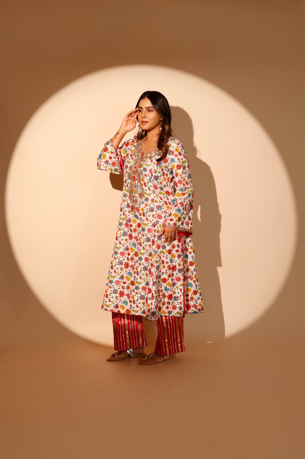 A model showcasing Multi Colour Blossom Kurta Set by Ashtar from Ashtar's collection