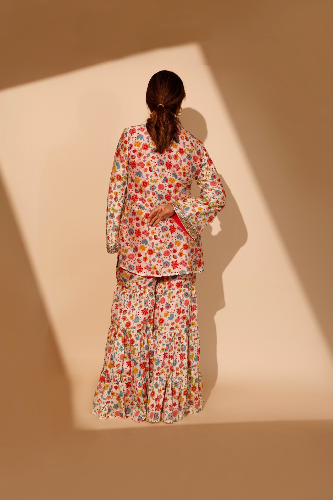 A model showcasing Multicolour Blossom Sharara Set by Ashtar from Ashtar's collection