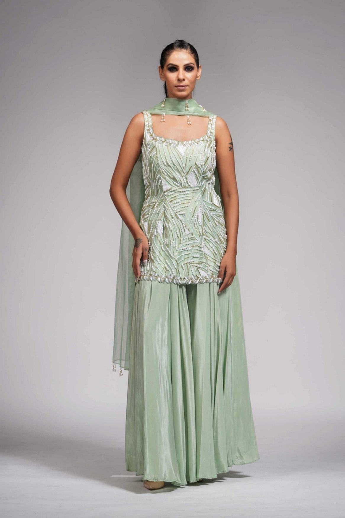 A model showcasing White Pearl Gold Embroidery Sharara Suit In Sea Green Feature image by Shruti S Label from Shruti S Label's collection
