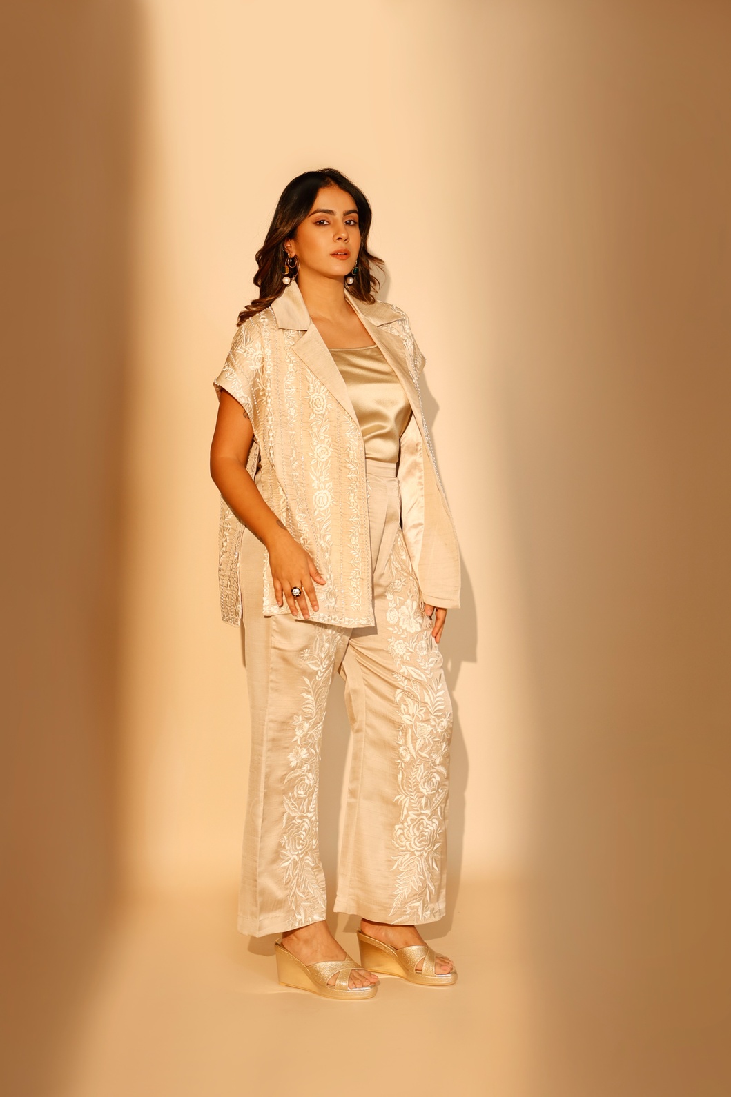A model showcasing Beige Luna Cape by Ashtar from Ashtar's collection