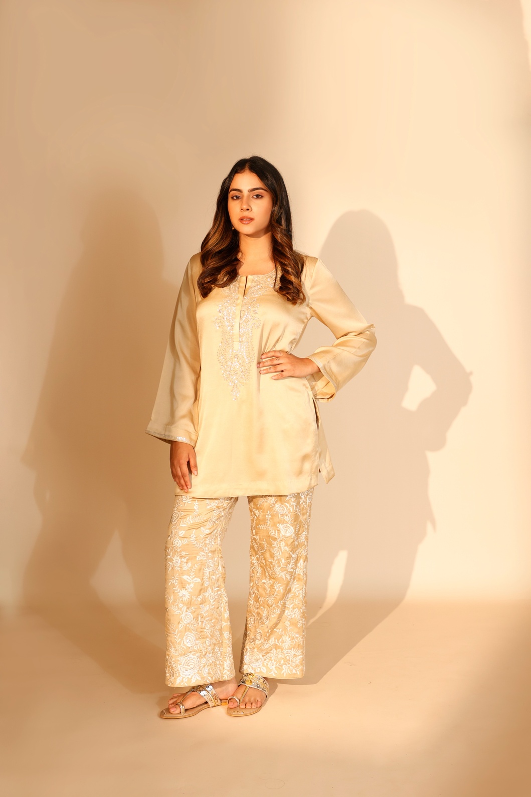 A model showcasing Beige Riva Twin Set by Ashtar from Ashtar's collection